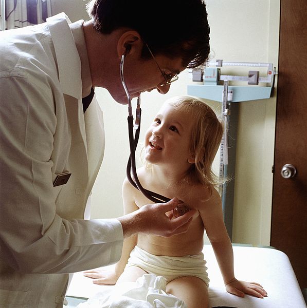 Doctor_uses_a_stethoscope_to_examine_a_young_patient.JPEG